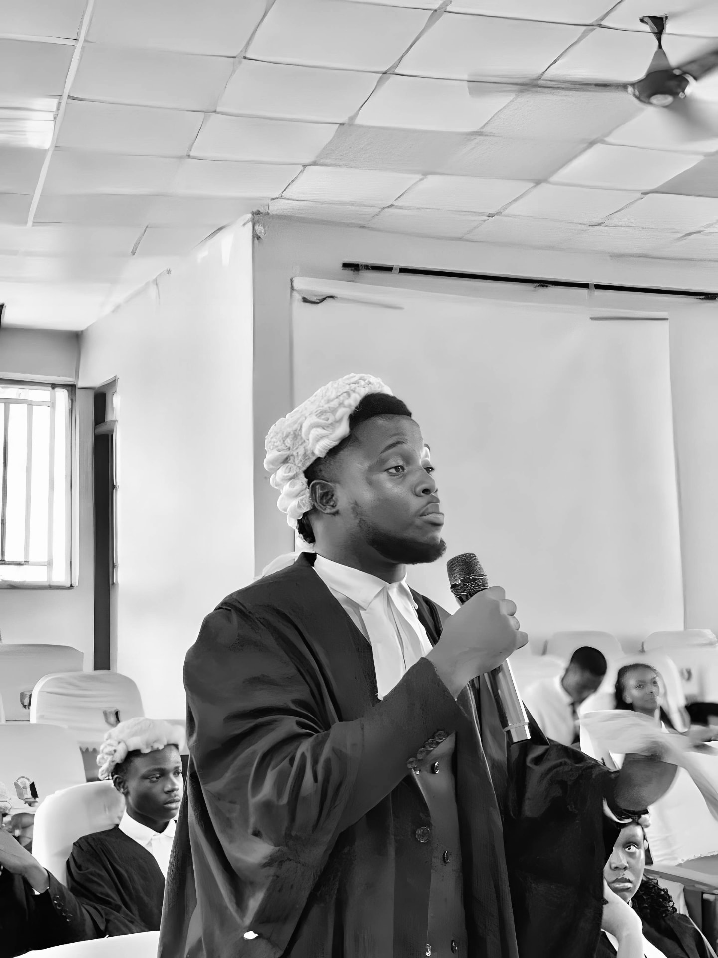 Emmanuel Excellence Ugochukwu presenting a legal argument in court attire